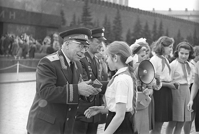 Figure 2: Children receiving their Komsomol memberships in Moscow’s Red Square, dressed in the typical uniform.